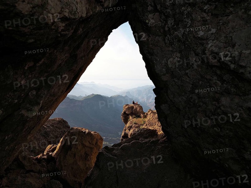 View through a rocky frame of a distant mountain landscape, Roque Nublo, Gran Canaria, Canary Islands, Canary Islands, Spain