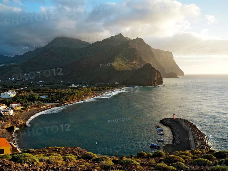 Coastal region with port and lighthouse, surrounded by mountains and sea, Puerto de la Aldea, Gran Canaria, Canary Islands, Spain