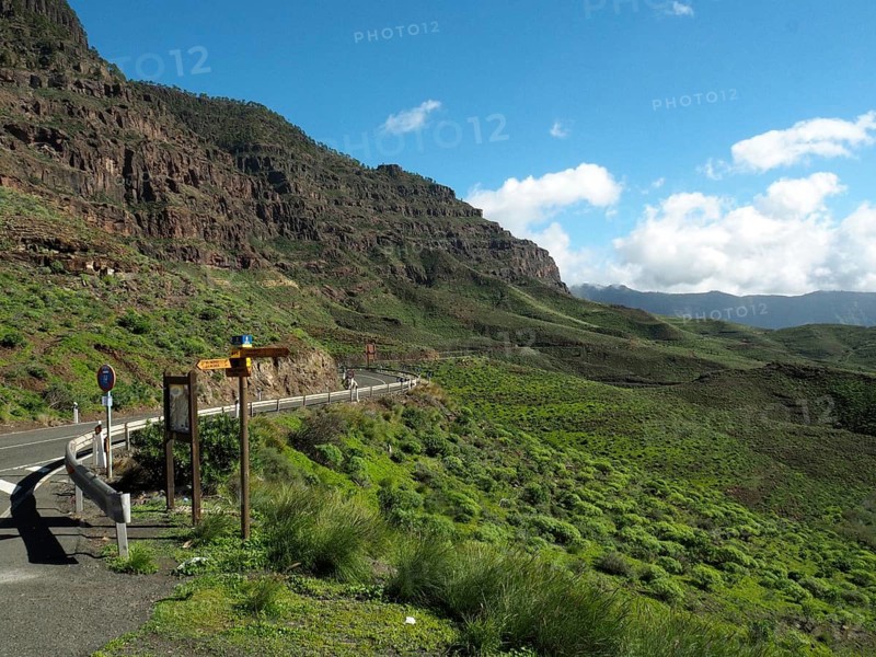 Scenic road through green mountains with clear skies, GC 200 near La Aldea de San Nicolas, Gran Canaria, Canary Islands, Spain