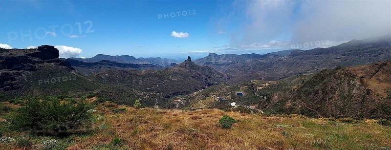 Wide mountain landscape with valley and cloudy sky in the distance. View from Cruz de Tejeda, Gran Canaria, Canary Islands, Canary Islands, Spain