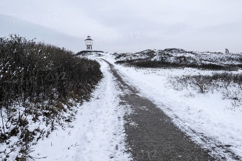 Water tower and dunes in snow, Langeoog, Lower Saxony, Germany