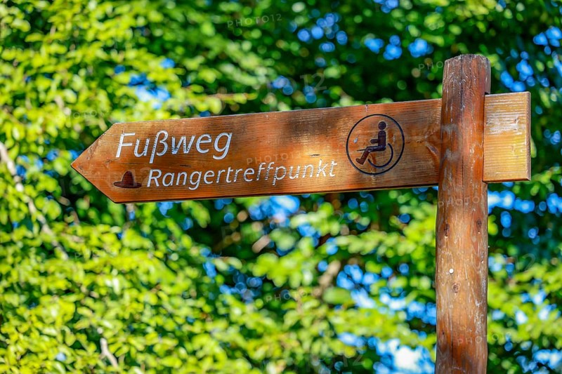 Schleiden, North Rhine-Westphalia, Germany — Eifel National Park. Signpost, footpath to the ranger meeting point. Barrier-free nature experience area Wilder Kermeter