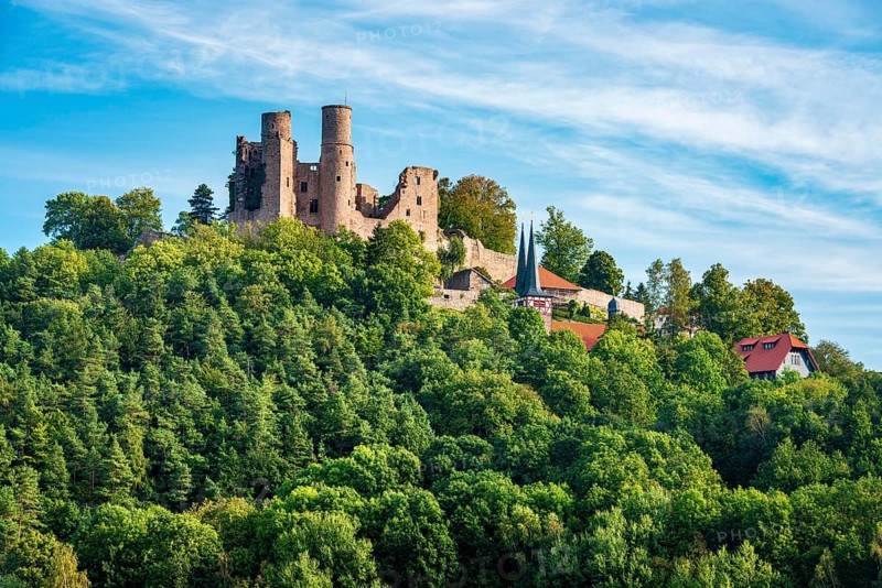 View of the ruins of Hanstein Castle and the small village of Rimbach, village church with half-timbered towers, Bornhagen, Eichsfeld, Thuringia, Germany