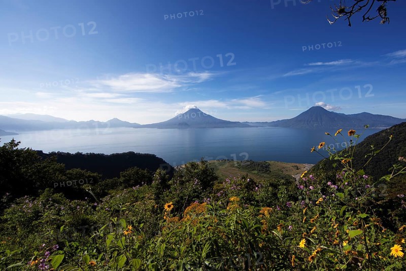 Lake Atitlán or Lake Atitlán in the morning, in the back the volcanoes San Pedro, Atitlán and Toliman, Panajachel, Sololá Department, Guatemala