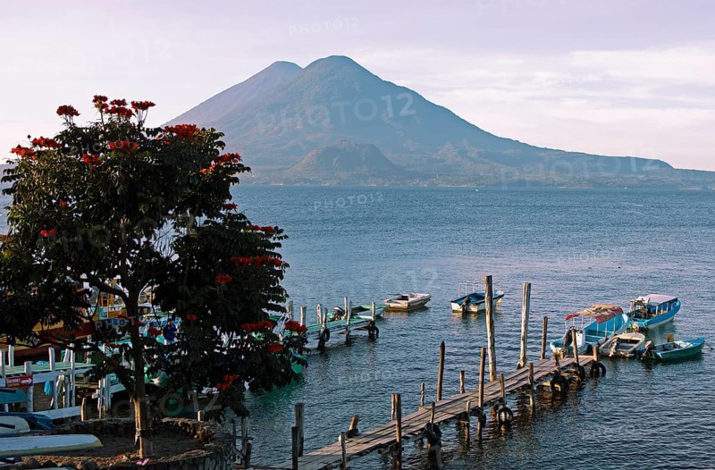 Boats on the dock, Lake Atitlán or Lake Atitlán in the morning, the volcanoes Atitlán and Toliman in the back, Panajachel, Sololá Department, Guatemala