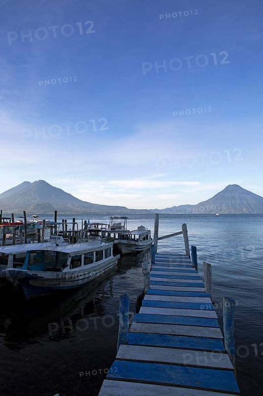 Boats on the pier, Lake Atitlán or Lake Atitlán in the morning, the volcanoes San Pedro, Atitlán and Toliman in the back, Panajachel, Sololá Department, Guatemala