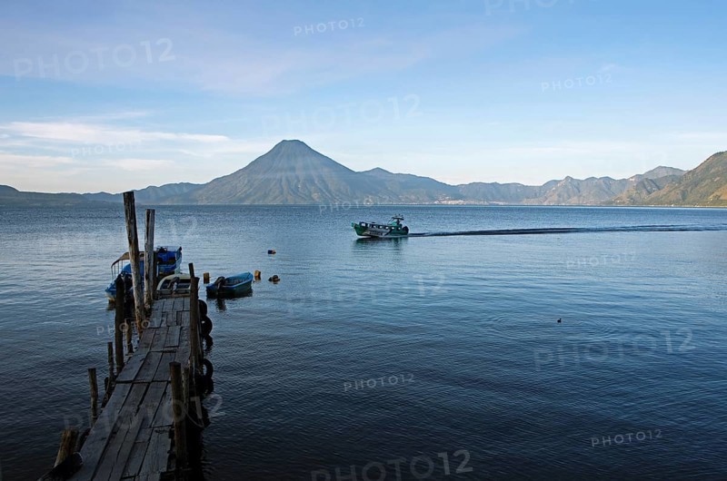 Boats on the pier, Lake Atitlán or Lake Atitlán in the morning, at the back of the San Pedro volcanoes, Panajachel, Sololá Department, Guatemala
