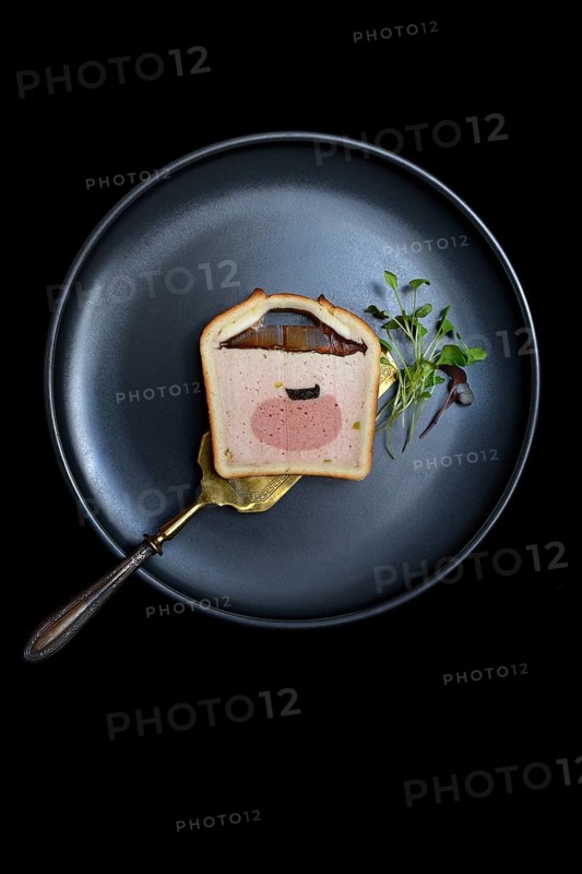 Battered pate on plate with microgreen