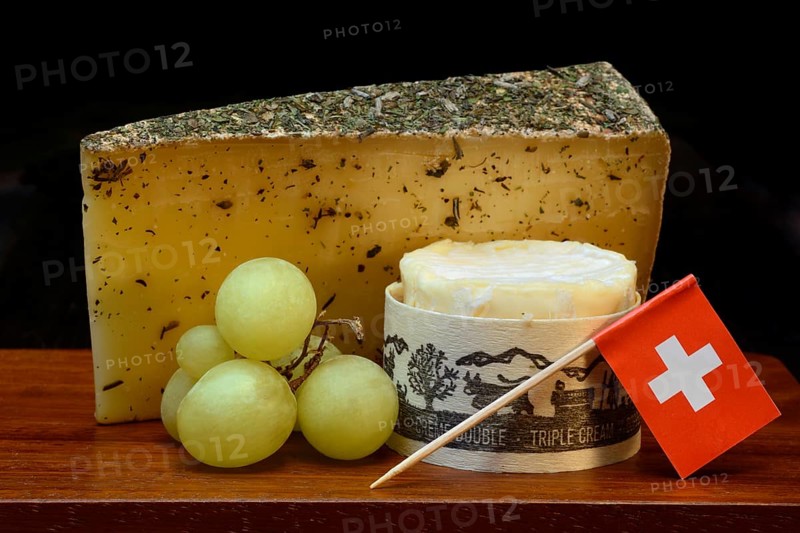 Plate of Swiss cheese, Gstaad mountain cheese with herbs and cream cheese 'Fette Berta', Switzerland