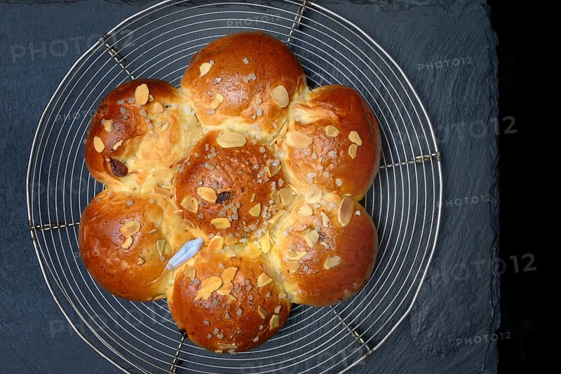 Epiphany cake with king on wire rack, Switzerland