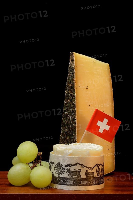 Plate of Swiss cheese, Gstaad mountain cheese with herbs and cream cheese 'Fette Berta', Switzerland