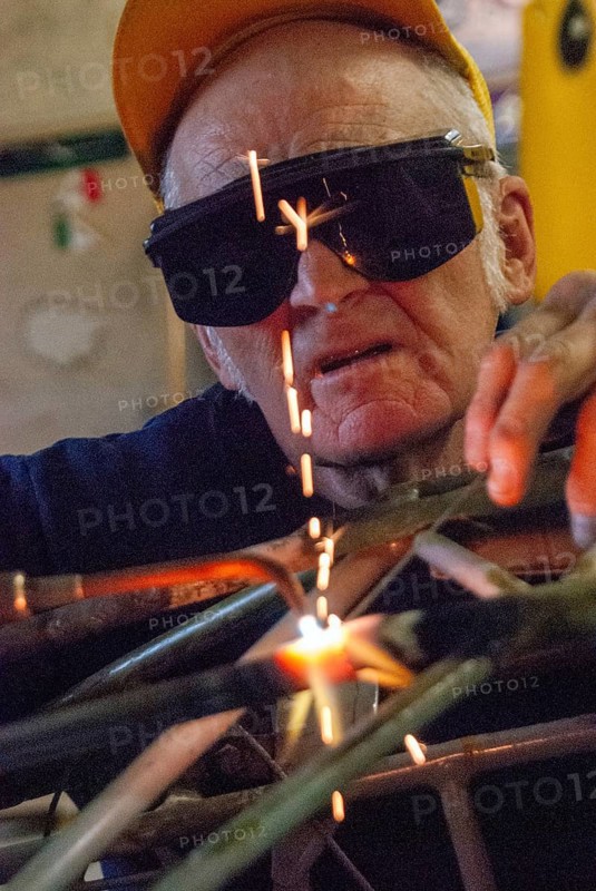 Old worker, welder, metal construction, working into old age, pensioner, car, safety glasses, connect