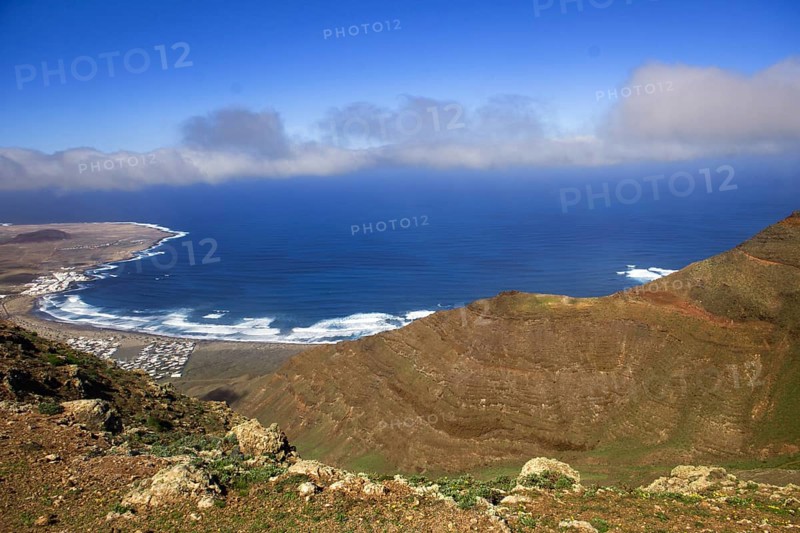 Panoramic view of the coast from Mirador de Ermita de Las Nieves with moving sea and slightly cloudy sky, Mirador de Ermita de Las Nieves, Lanzarote