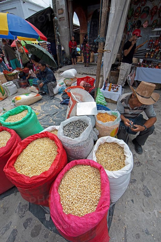 Different colored corn in bags for sale at the market in Chichicastenango, Highlands, El Quiché Department, Guatemala