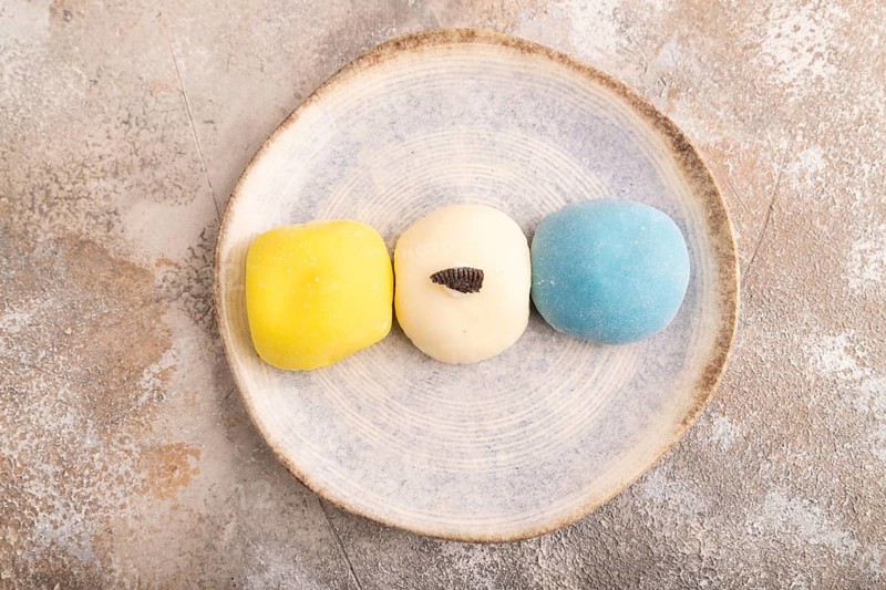 Japanese Mochi Cakes on brown concrete background, top view, flat lay, close up