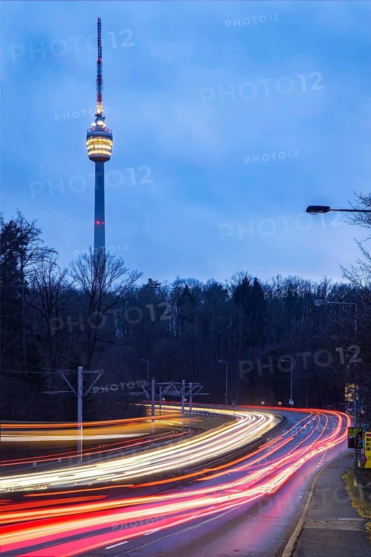 The television tower is the landmark of the state capital Stuttgart. The pulpit is illuminated in the evening. Before that, there are traces of light from vehicles. The SWR TV Tower is celebrating its 70th anniversary in 2026. Stuttgart, Baden-Württemberg, Germany