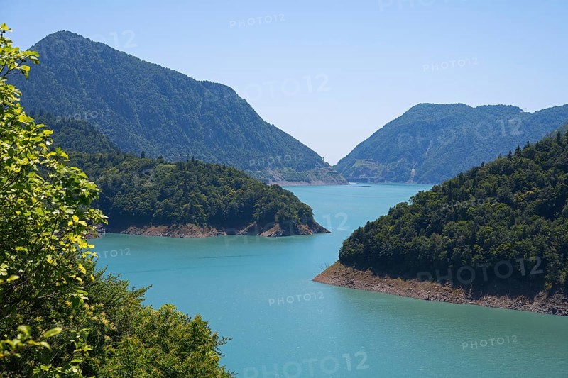 Large, calm lake surrounded by forested mountains, Jvari Reservoir, Enguri River, Mingrelia region and Upper Svaneti, Georgia