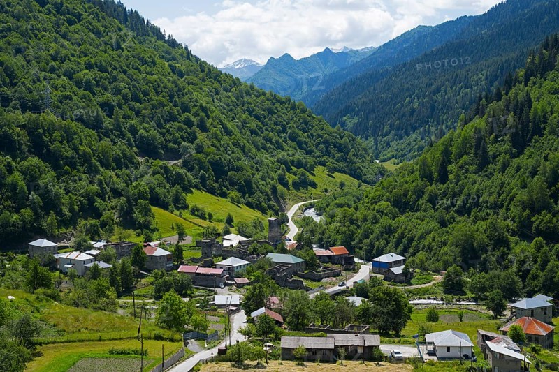 Idyllic mountain village surrounded by lush nature and green hills, Bogreshi, road 7, Mingrelia and Upper Svaneti region, High Caucasus, Georgia