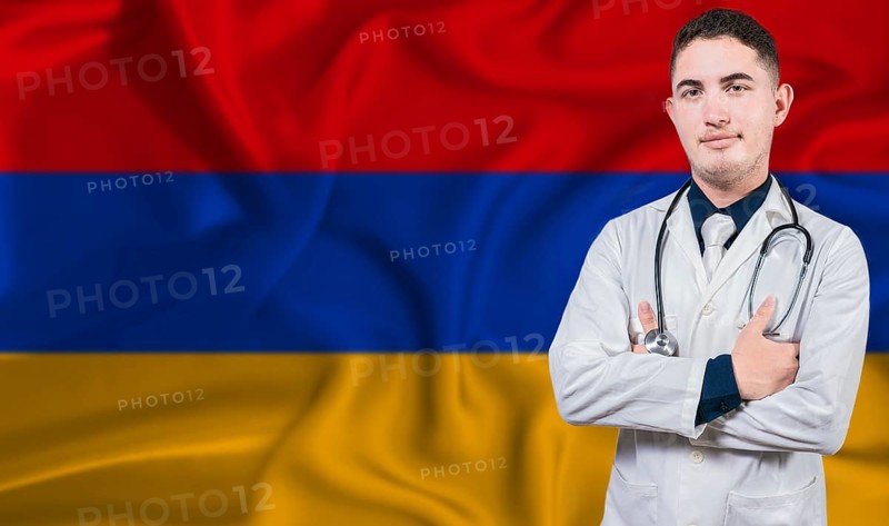 Portrait of medical professional on Armenia flag background. Armenian national health system