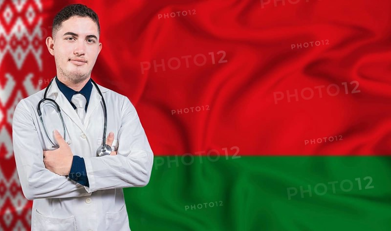 Portrait of medical professional on Belarus flag background. Belarusian national health system