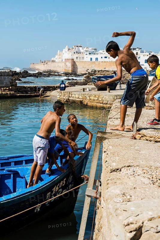 Children playing on the promenade, Essaouira, UNESCO World Heritage Site, Atlantic coast, Morocco