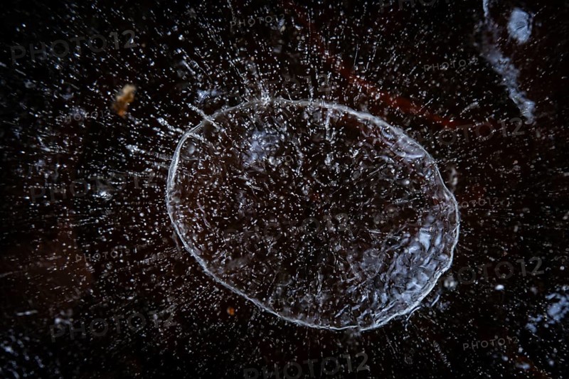 Air bubble in the ice of a frozen lake in winter, Finland