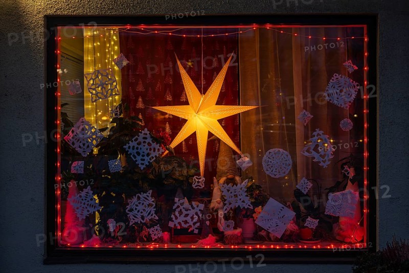Christmas decorated and illuminated shop window with Christmas stars and fairy lights, Sysmä, Finland