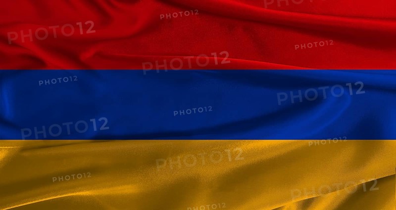 Flag of Armenia with fabric textured background. Close up of National flag of Armenia with realistic texture