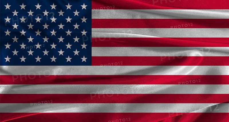 Flag of the United States with fabric textured background. Close up of National flag of the United States with realistic texture
