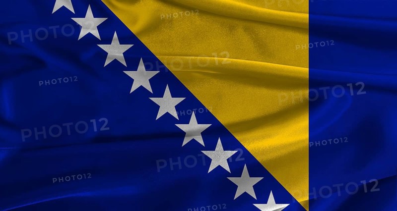 Flag of Bosnia and Herzegovina with fabric textured background. Close up of National flag of Bosnia and Herzegovina with realistic texture
