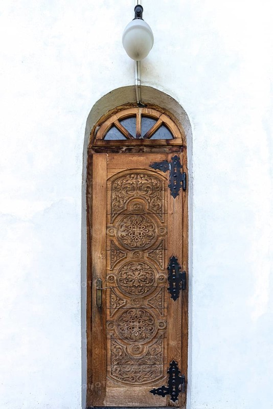 Carved main entrance to Romanian Orthodox monastery Bogdana, Radauti, Romania