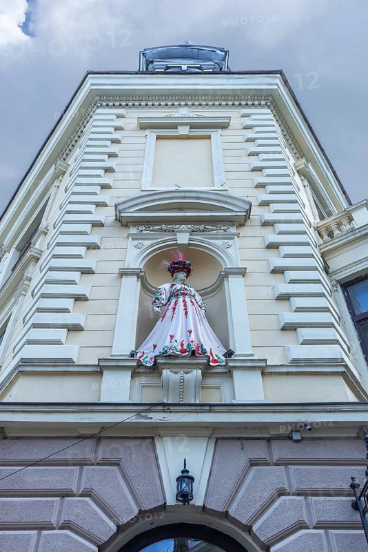 Mannequin in Ukrainian traditional costume in a niche at a 19th-century house, Czernowicz, Ukraine