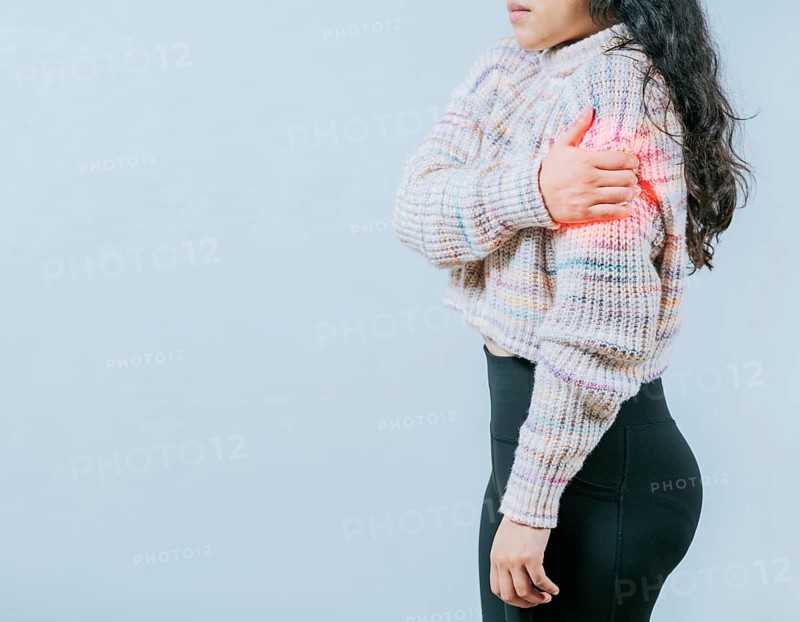 Female person with arm pain and muscle tension. Young woman with arm pain isolated