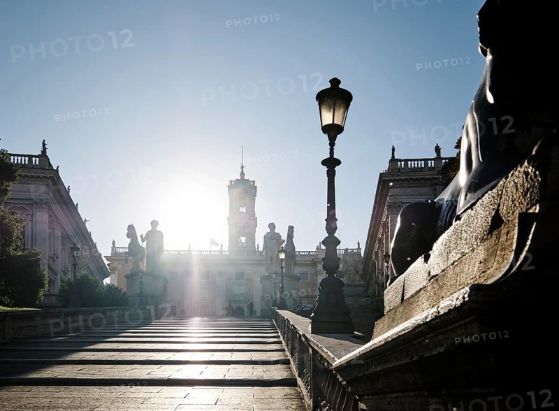 Staircase leading to the Capitoline Square, Statues of the Dioscuri Castor and Pollux, Piazza di Campidoglio backlit on the Capitoline Hill, Palazzo Senatorio, Palazzo dei Conservatori, Rome, Lazio, Italy