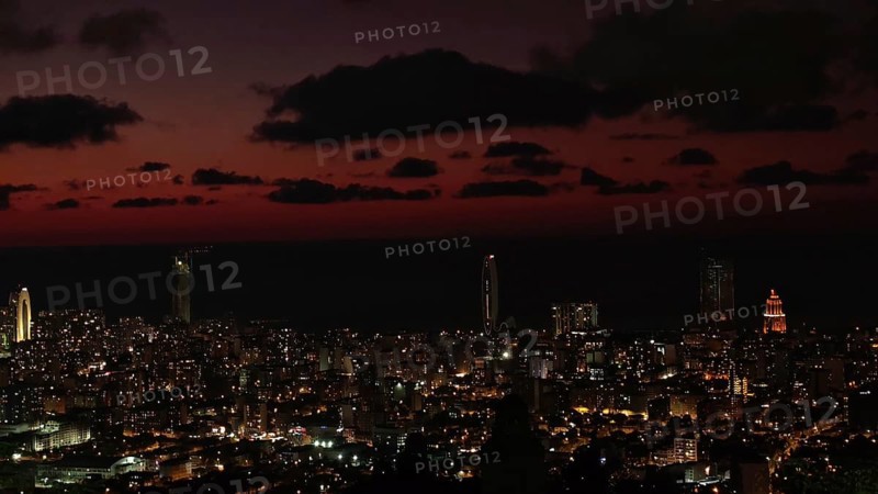 City view at night with illuminated buildings and dark sky, Batumi, Georgia