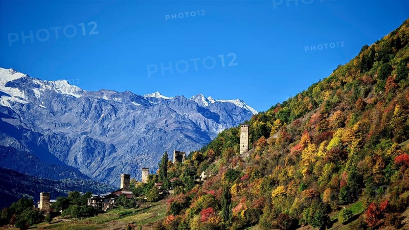 Mountain landscape with thick forests and medieval towers in autumn, Mestia, Georgia