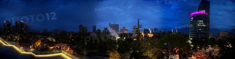 Panoramic view of an illuminated skyline at night with skyscrapers and lights, Tirana, Albania
