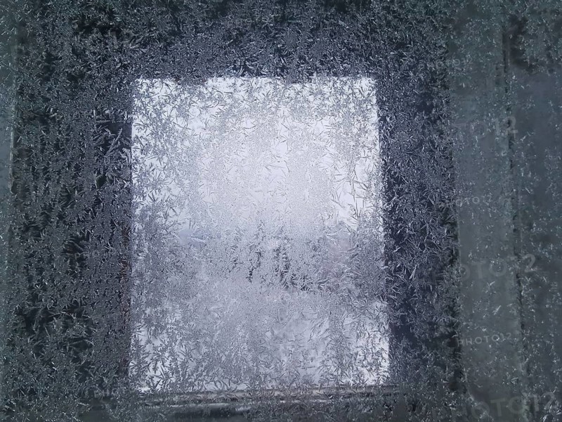 An icy window with frosty structures that give off a cold winter feeling, Franconian Forest nature park Park