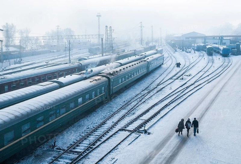 Irkutsk, Siberia, Russia. The train station where the Trans-Siberian railway stops mid-way in its journey to and fro Moscow Vladivostok during a snow storm
