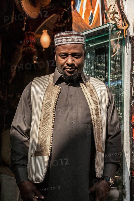 Misurata, Libya, North Africa. A Libyan man from one of the numerous desert tribes in his shop in the Italian influenced town in the desert