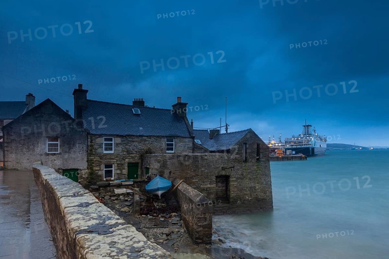Lerwick, Shetland Islands, Scotland, UK. A traditional stone house at the sea near the port in Lerwick