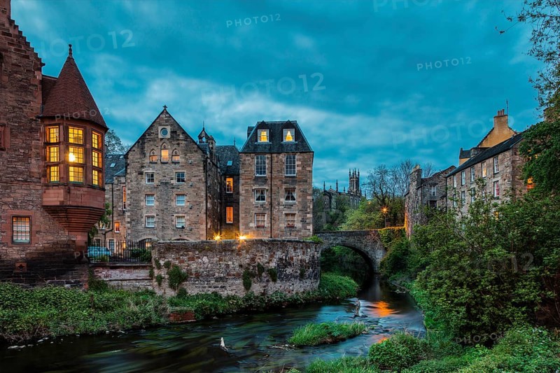 Dean Village, Edinburgh, Scotland, UK. Traditional houses and church with canal in historic Dean Village