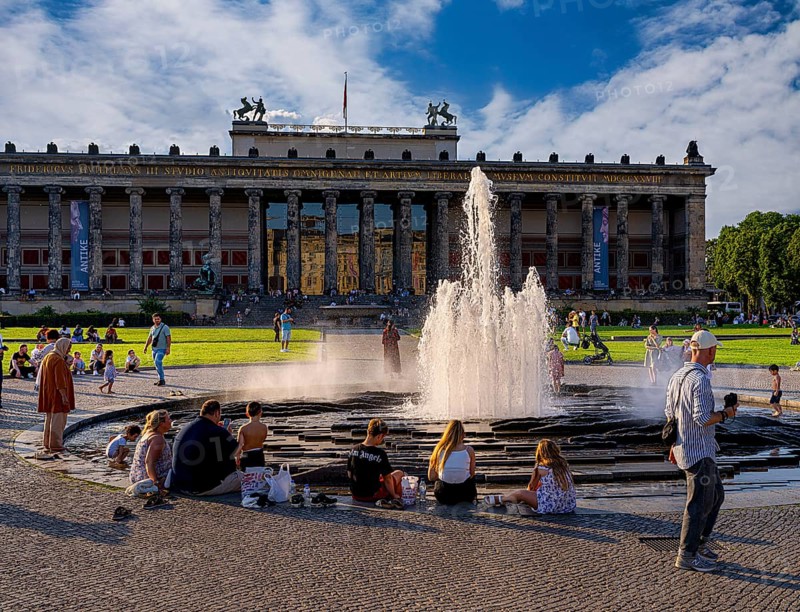Water fountain, summer lifestyle, tourists and passers-by in the pleasure garden in Berlin-Mitte, Berlin, Germany