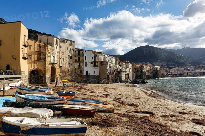 Traditional fishing boats on the shore, La Rocca mountain, Tyrrhenian Sea, Cefalu, Cefalù, Sicily, Italy