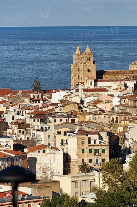 City view of Cefalù in winter, view over the rooftops of Santissimo Salvatore Cathedral, UNESCO World Heritage Site, and the Tyrrhenian Sea, medieval old town, Cefalu, Sicily, Italy