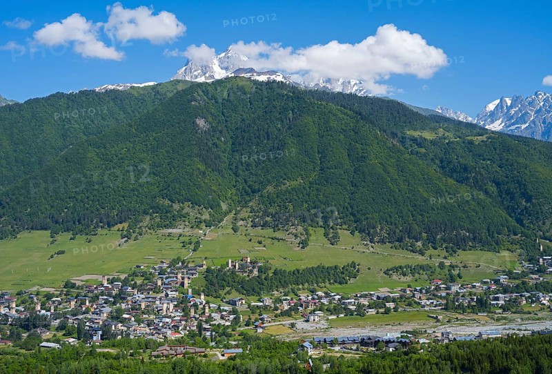 Village in an extensive, green hilly landscape with mountain scenery, Mestia, Mingrelia and Upper Svaneti, Svaneti, High Caucasus, Georgia