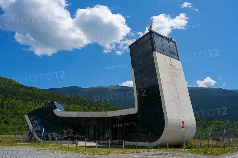 Modern building with futuristic design in front of a picturesque mountain landscape, airport building, Queen Tamar Airport, designed by Jürgen Mayer, Mestia, Mingrelia and Upper Svaneti, Svaneti, High Caucasus, Georgia
