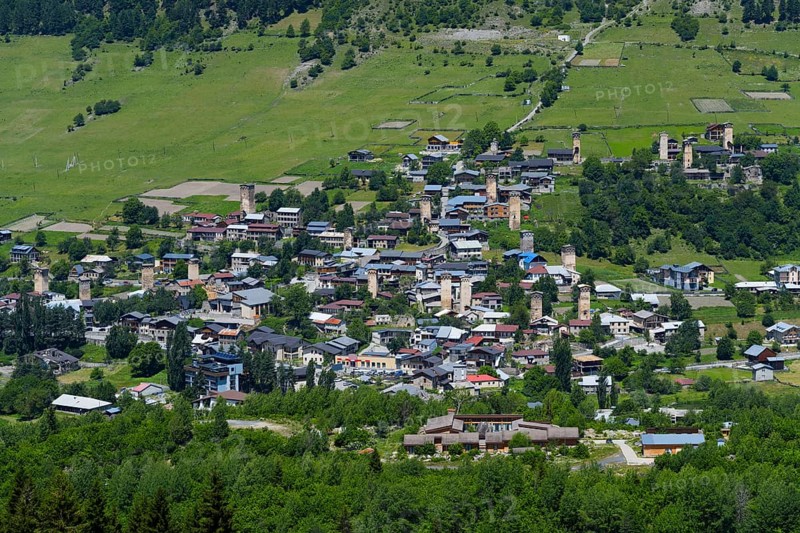 A village with scattered old houses in a green mountain landscape, defensive towers, Mestia, Mingrelia and Upper Svaneti, Svaneti, High Caucasus, Georgia