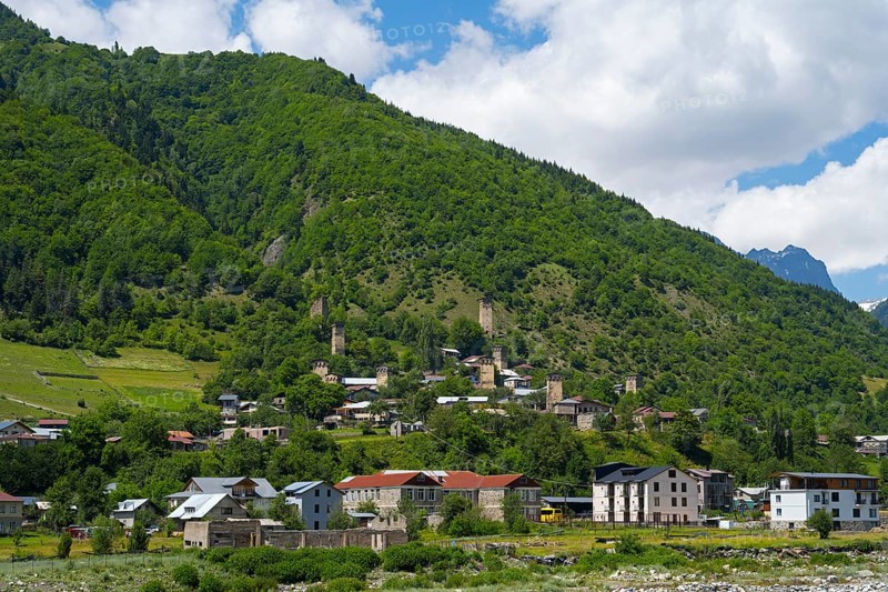 Picturesque village on a mountainside surrounded by lush greenery and mountains, Mestia, Mingrelia and Upper Svaneti, Svaneti, High Caucasus, Georgia