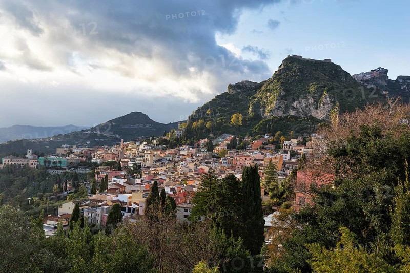 View of picturesque town, hills and mountains, panoramic view, Taormina, Sicily, Italy